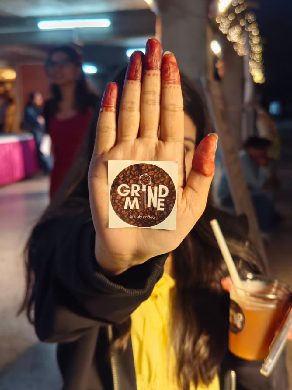 Brew Date sticker on a hand